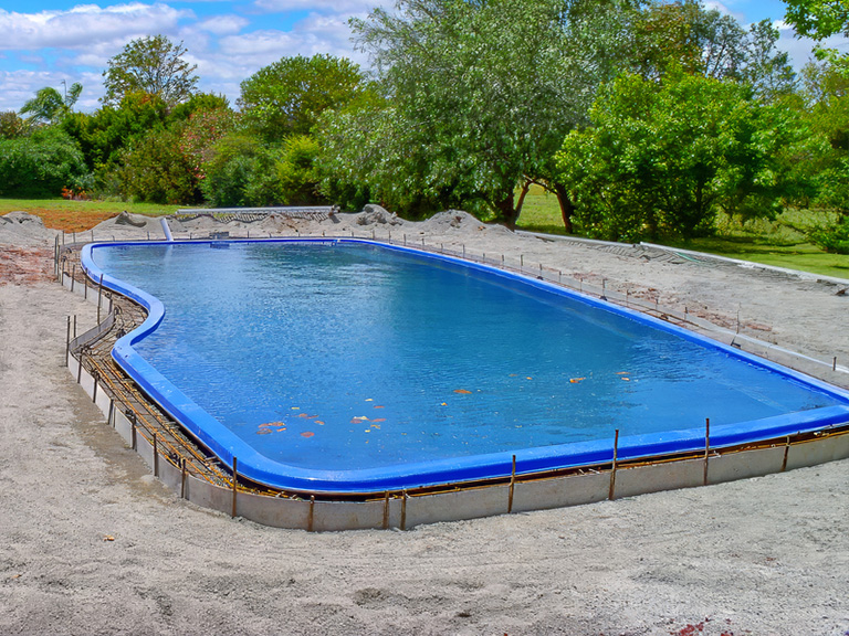 a pool next to a body of water